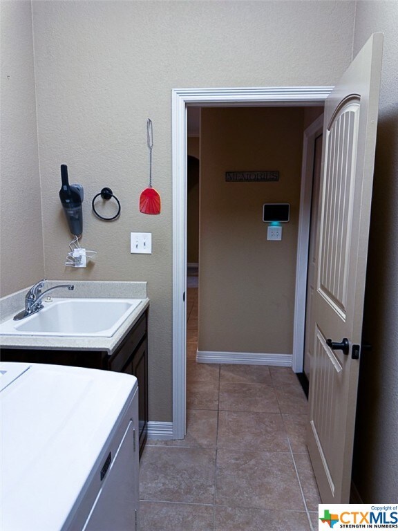 bathroom featuring vanity and tile patterned floors