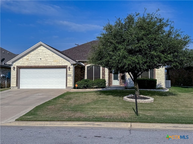 view of front of property featuring a garage and a front yard