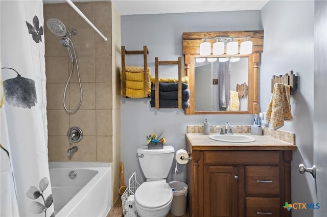 full bathroom featuring shower / tub combo, toilet, and vanity