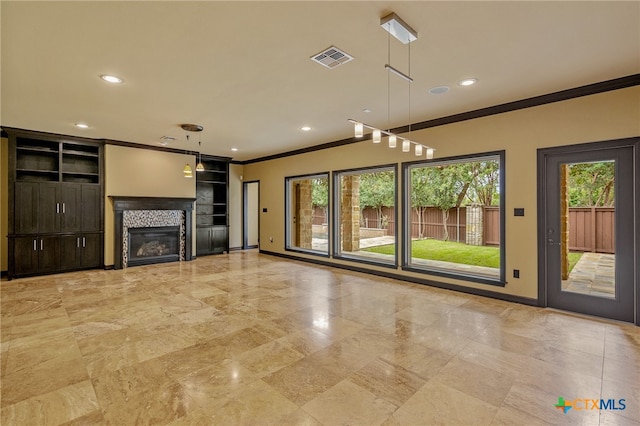 unfurnished living room with ornamental molding and a fireplace