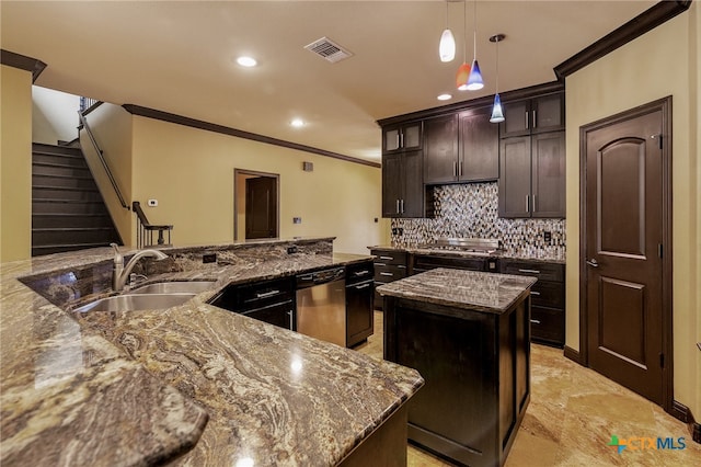 kitchen with a kitchen island, appliances with stainless steel finishes, dark brown cabinets, pendant lighting, and sink