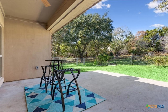 view of patio featuring ceiling fan