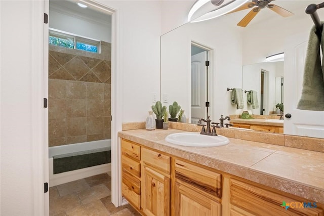 bathroom with ceiling fan and vanity