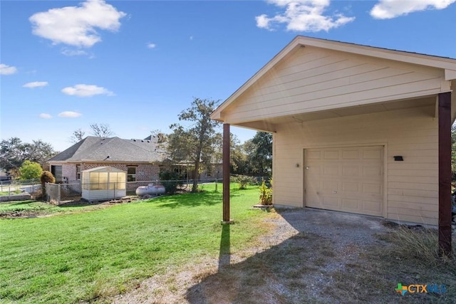 view of property exterior featuring a yard and a garage