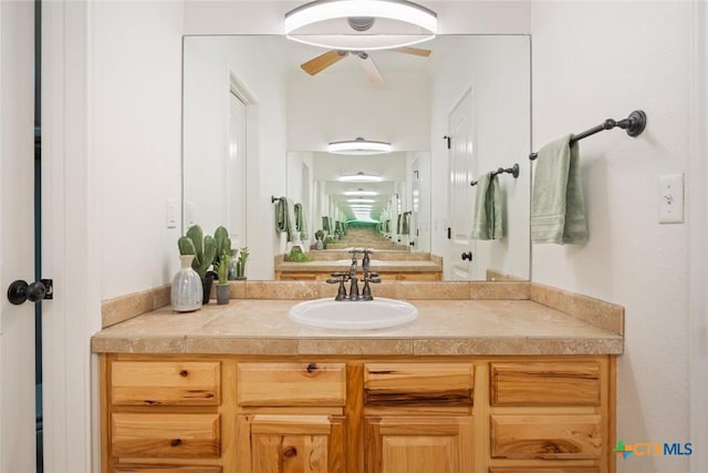 bathroom featuring ceiling fan and vanity