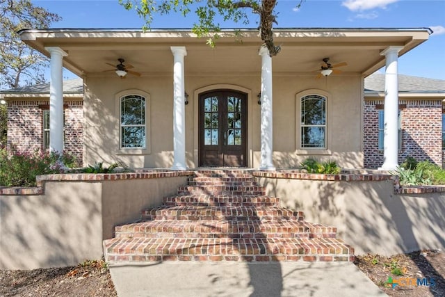 doorway to property featuring ceiling fan and covered porch