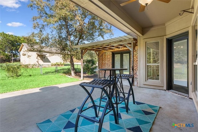 view of patio with french doors and ceiling fan