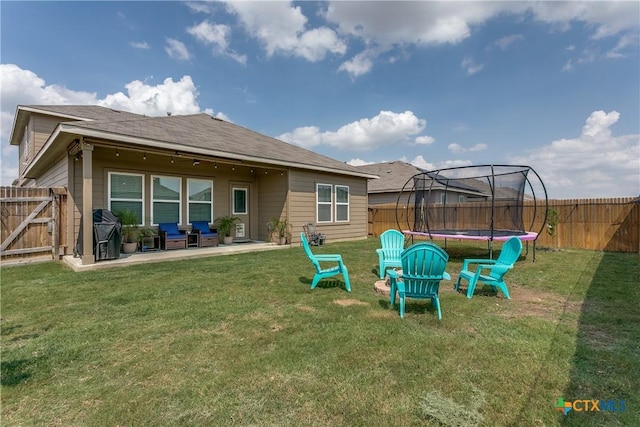 391 Walnut Crk, New Braunfels, TX 78130 - back of property with a trampoline and a patio
