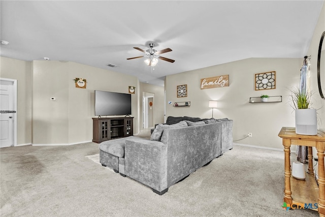 carpeted living room featuring vaulted ceiling and ceiling fan