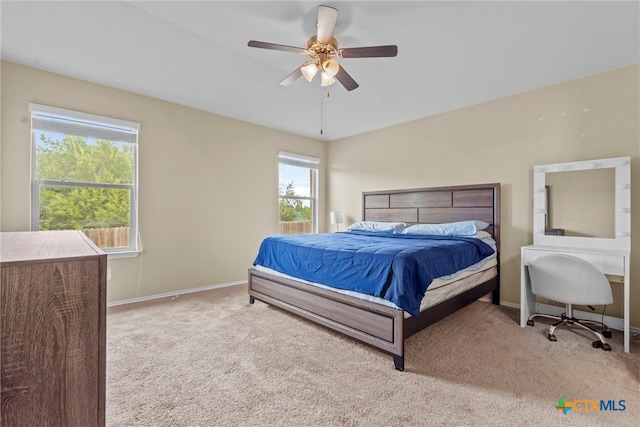 bedroom featuring ceiling fan and light colored carpet