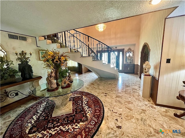 entrance foyer with a textured ceiling