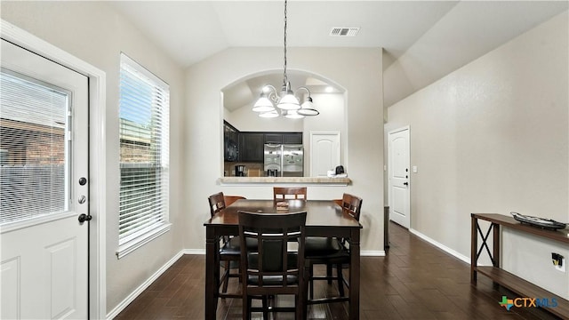 557/561 Creekside Cir, New Braunfels, TX 78130 - dining area featuring a chandelier, vaulted ceiling, and dark wood-style floors