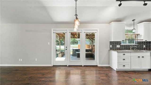 543 Scenic Terrace Dr, Canyon Lake, TX 78133 - kitchen featuring dark wood-style flooring, healthy amount of natural light, and white cabinets