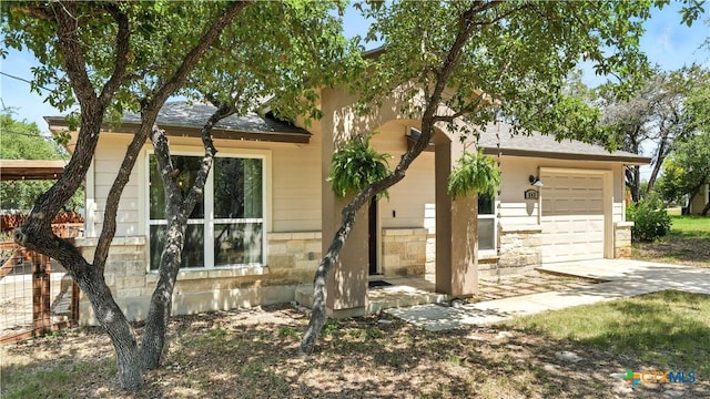 543 Scenic Terrace Dr, Canyon Lake, TX 78133 - view of property exterior featuring concrete driveway, stone siding, and roof with shingles