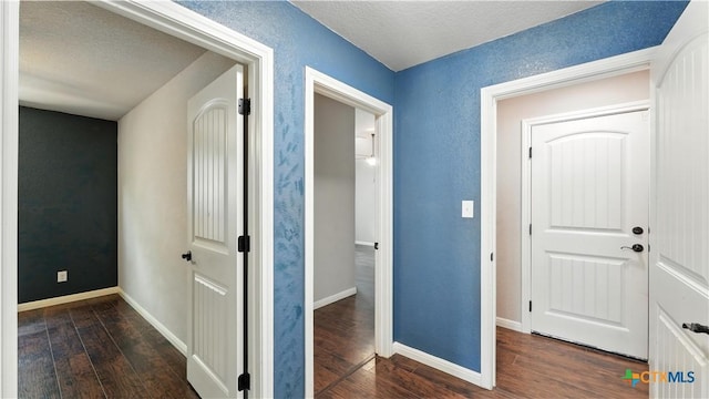 543 Scenic Terrace Dr, Canyon Lake, TX 78133 - corridor featuring dark wood-style floors and a textured ceiling