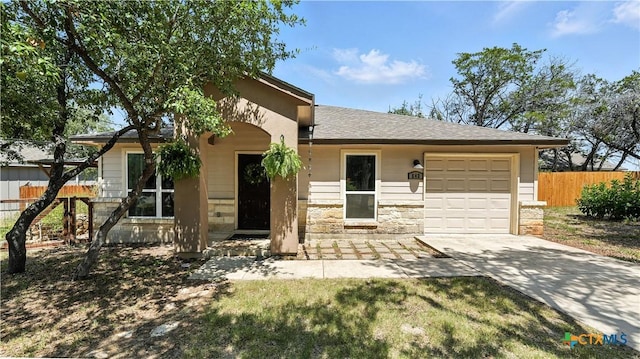 543 Scenic Terrace Dr, Canyon Lake, TX 78133 - view of front of property with a garage, stone siding, driveway, and a shingled roof