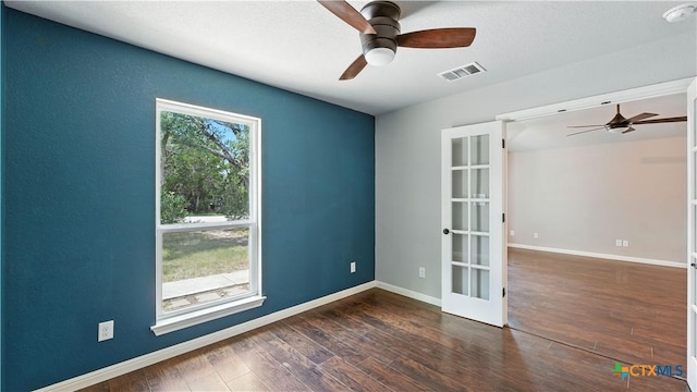 543 Scenic Terrace Dr, Canyon Lake, TX 78133 - empty room with a ceiling fan, french doors, wood finished floors, and a smoke detector