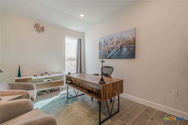 office space with dark wood-type flooring