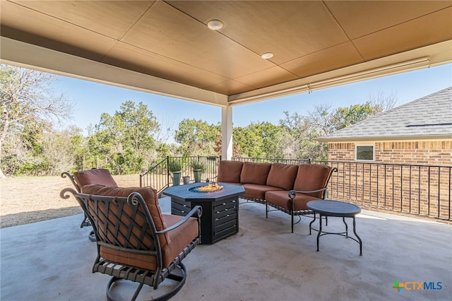 view of patio / terrace featuring an outdoor living space with a fire pit