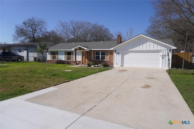 ranch-style home featuring a garage and a front yard