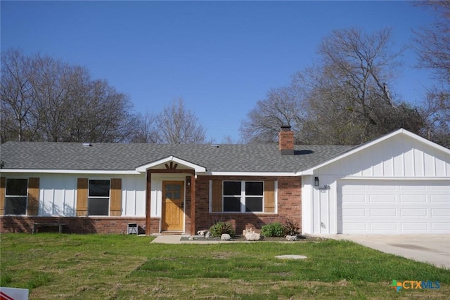 ranch-style home featuring a garage and a front lawn