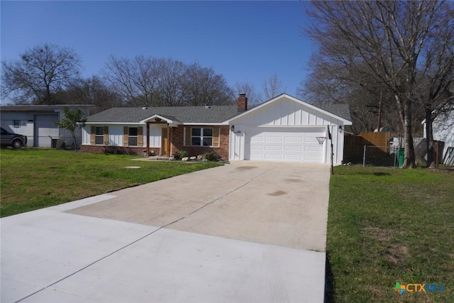 ranch-style house featuring a garage and a front lawn