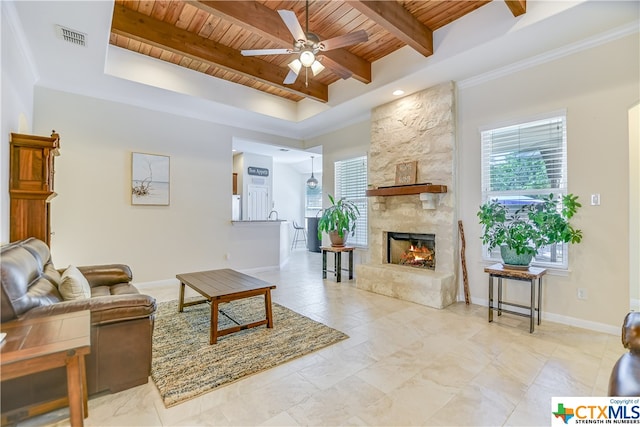 living room featuring ornamental molding, wood ceiling, a large fireplace, beamed ceiling, and ceiling fan