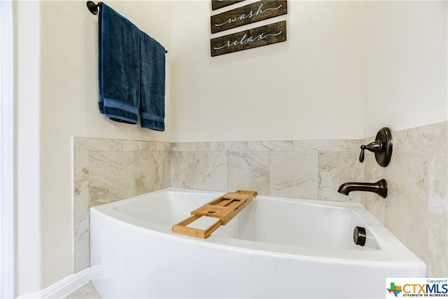 bathroom with a tub