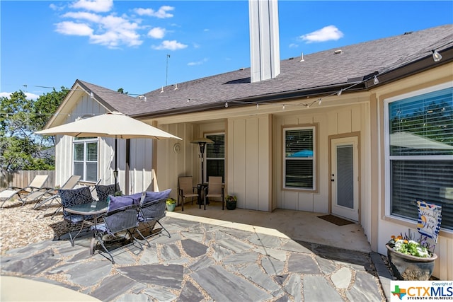 rear view of property featuring a patio area