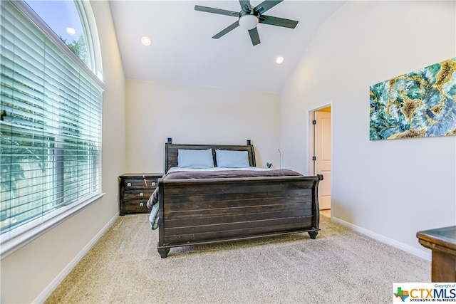 carpeted bedroom featuring ceiling fan and high vaulted ceiling