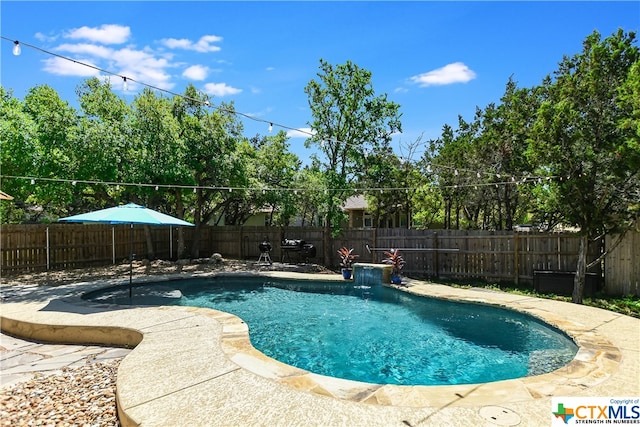 view of swimming pool featuring a patio and pool water feature