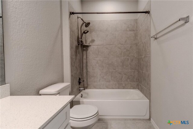 2800 Joe Dimaggio Blvd Unit 95, Round Rock, TX 78665 - bathroom featuring toilet, vanity, bathing tub / shower combination, a textured wall, and tile patterned flooring