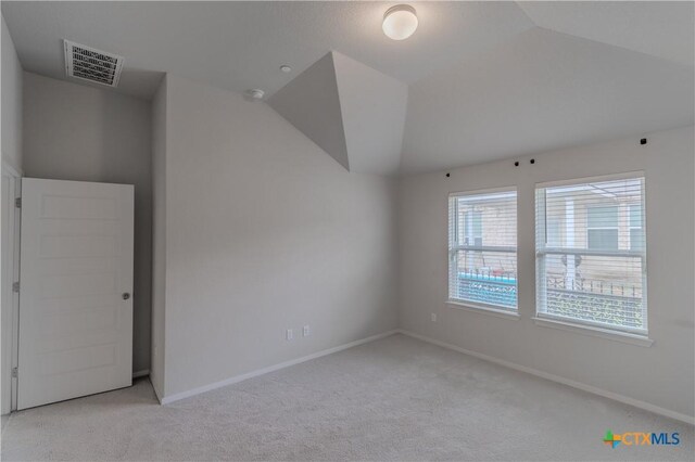 2800 Joe Dimaggio Blvd Unit 95, Round Rock, TX 78665 - unfurnished room featuring light colored carpet, baseboards, and lofted ceiling