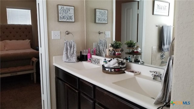 1904 Twisted Riv, New Braunfels, TX 78130 - ensuite bathroom with double vanity and a textured wall