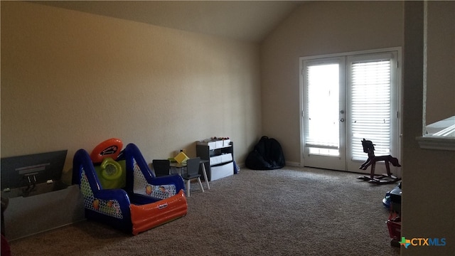 game room featuring carpet flooring, a wealth of natural light, and lofted ceiling