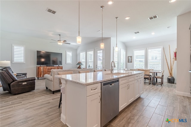 kitchen with white cabinetry, a center island with sink, dishwasher, pendant lighting, and sink