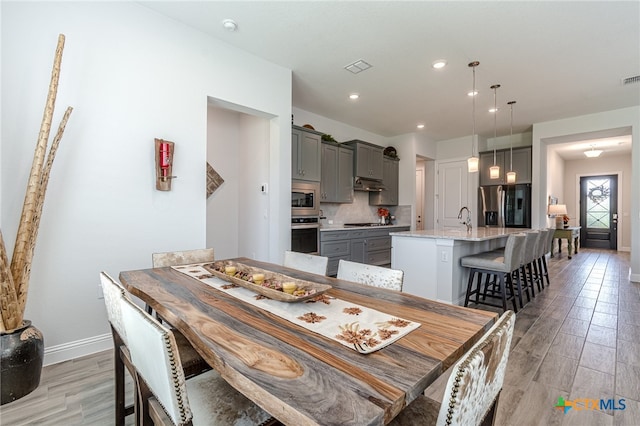 dining space featuring sink