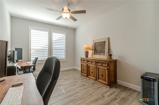 office area with ceiling fan and wine cooler