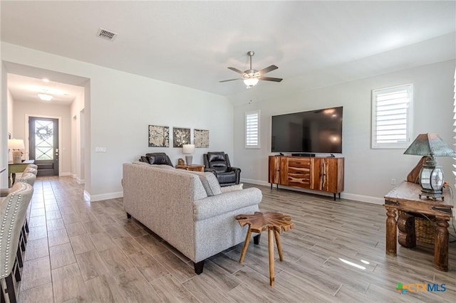 living room featuring ceiling fan