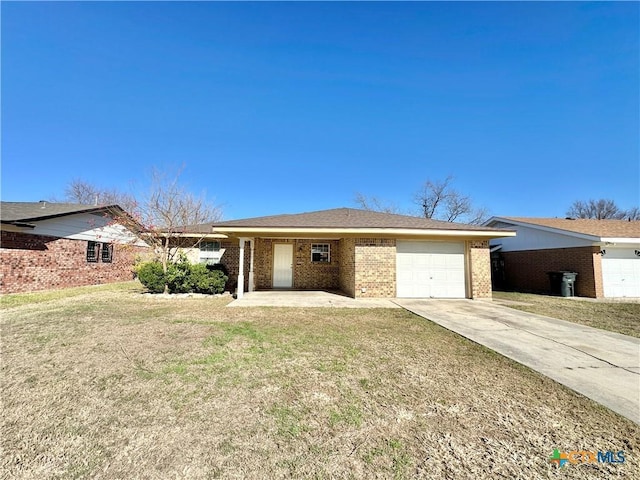 single story home with a garage and a front lawn