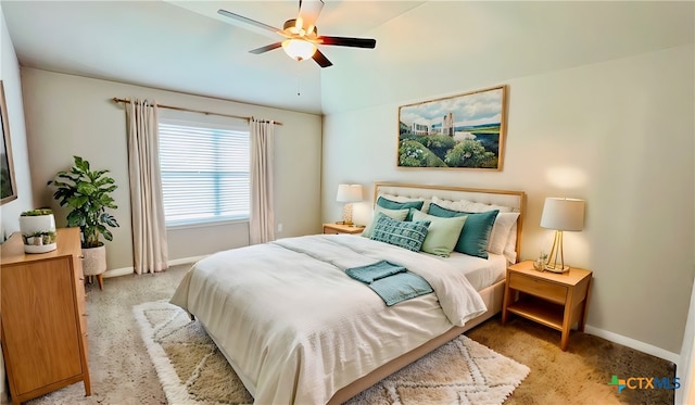 bedroom with light colored carpet and ceiling fan