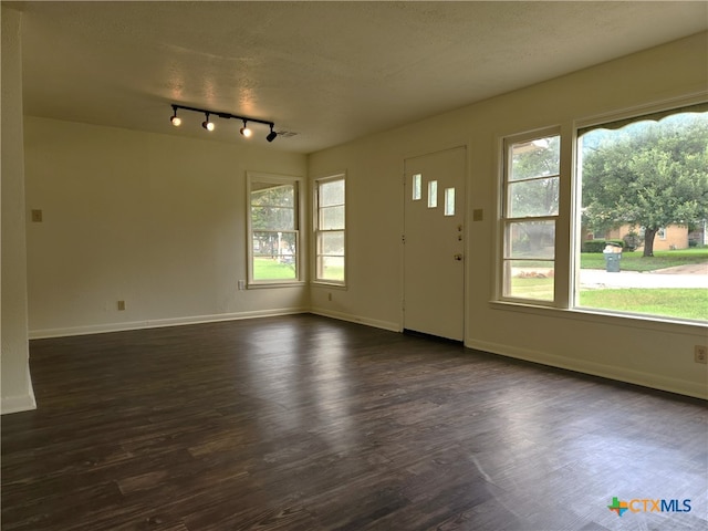 201 W Young Ave, Temple, TX 76501 - foyer with baseboards, dark wood-style floors, track lighting, and a textured ceiling
