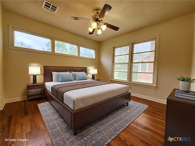 201 W Young Ave, Temple, TX 76501 - bedroom with dark wood-style floors and ceiling fan