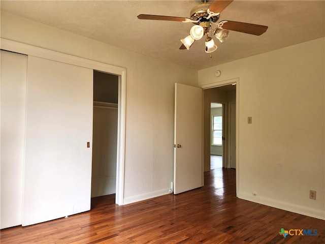 201 W Young Ave, Temple, TX 76501 - unfurnished bedroom featuring a closet, wood finished floors, baseboards, and a ceiling fan