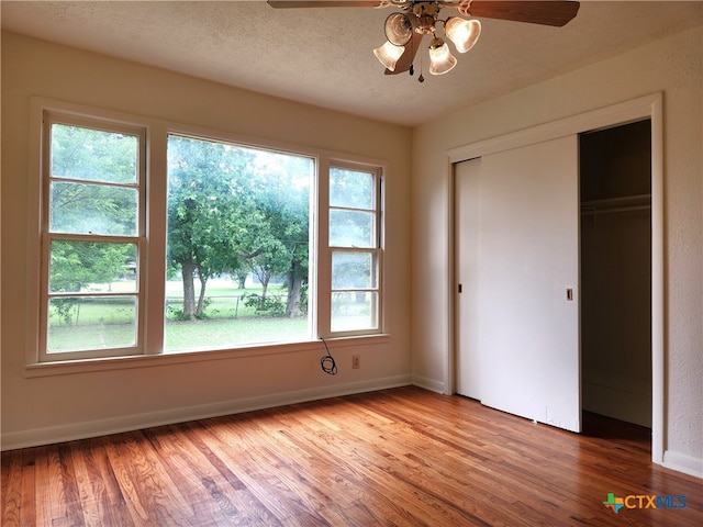 201 W Young Ave, Temple, TX 76501 - unfurnished bedroom with light wood finished floors, a closet, baseboards, and ceiling fan