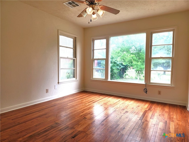 201 W Young Ave, Temple, TX 76501 - empty room with light wood-style flooring, baseboards, a ceiling fan, and a textured ceiling