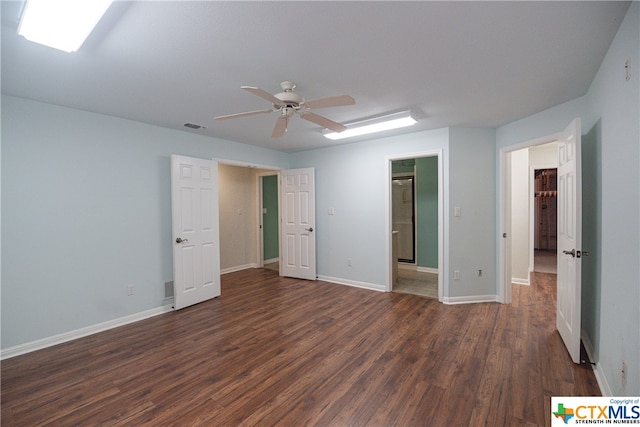 unfurnished bedroom with ceiling fan and dark hardwood / wood-style floors