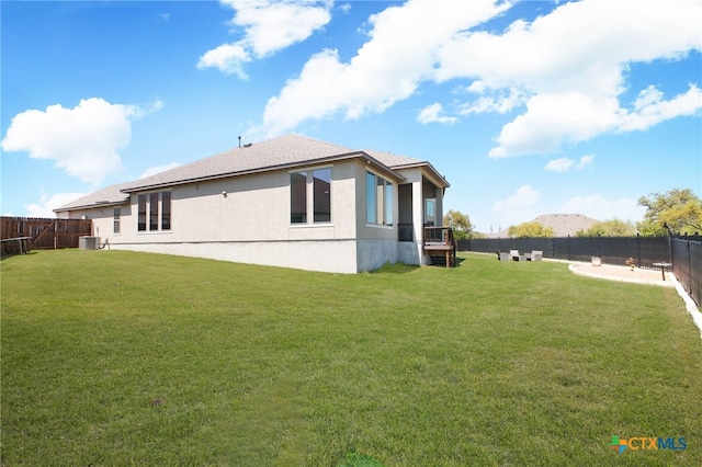 1386 Lyme Park, Bulverde, TX 78163 - back of property featuring stucco siding and a fenced backyard
