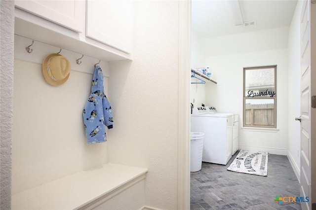 1386 Lyme Park, Bulverde, TX 78163 - laundry room featuring washing machine and dryer, cabinet space, and wood finished floors
