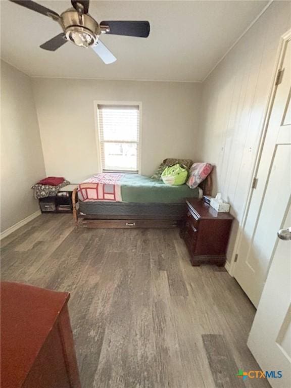 bedroom featuring wood-type flooring and ceiling fan